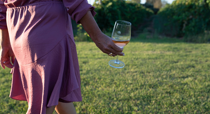 Glass of Yarran Rosé being carried